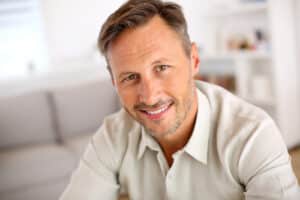 Attractive smiling man relaxing at home